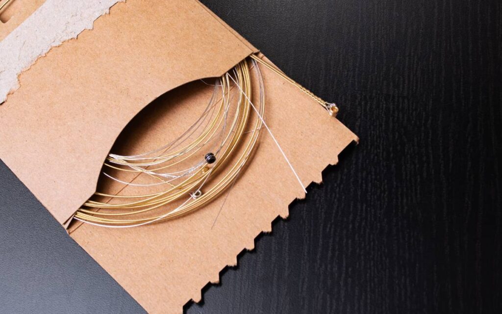 Close up of guitar strings in cardboard packing