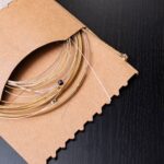 Close up of guitar strings in a cardboard packing