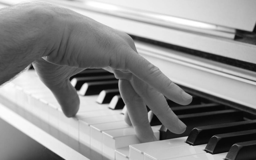 Fingers on piano keys