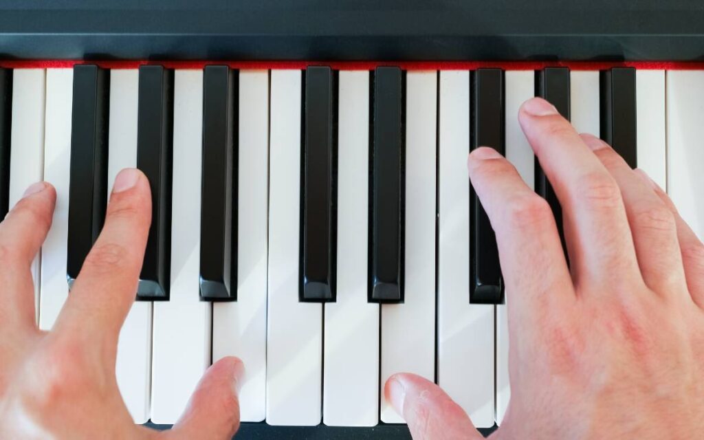 Man's hands on piano keys