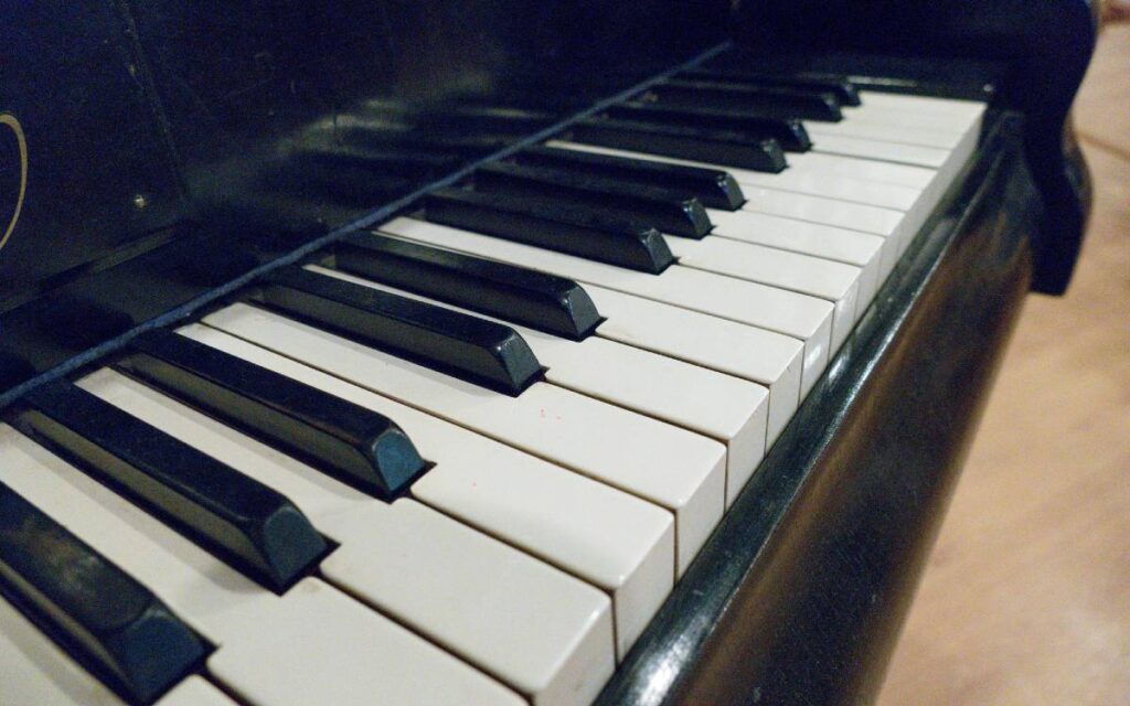 Piano keys of a black grand piano