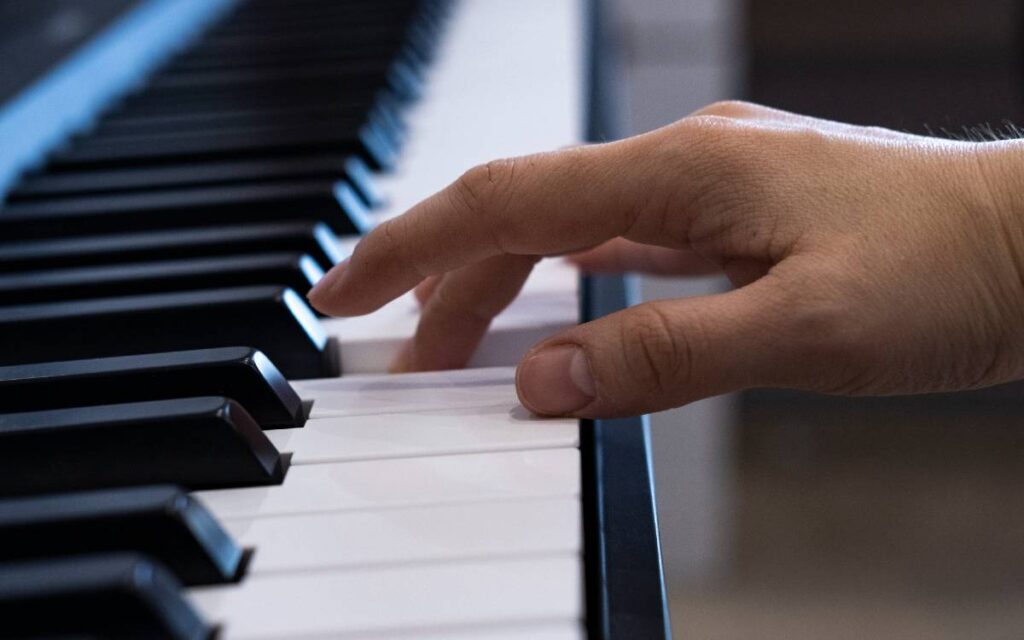 Fingers on piano keys