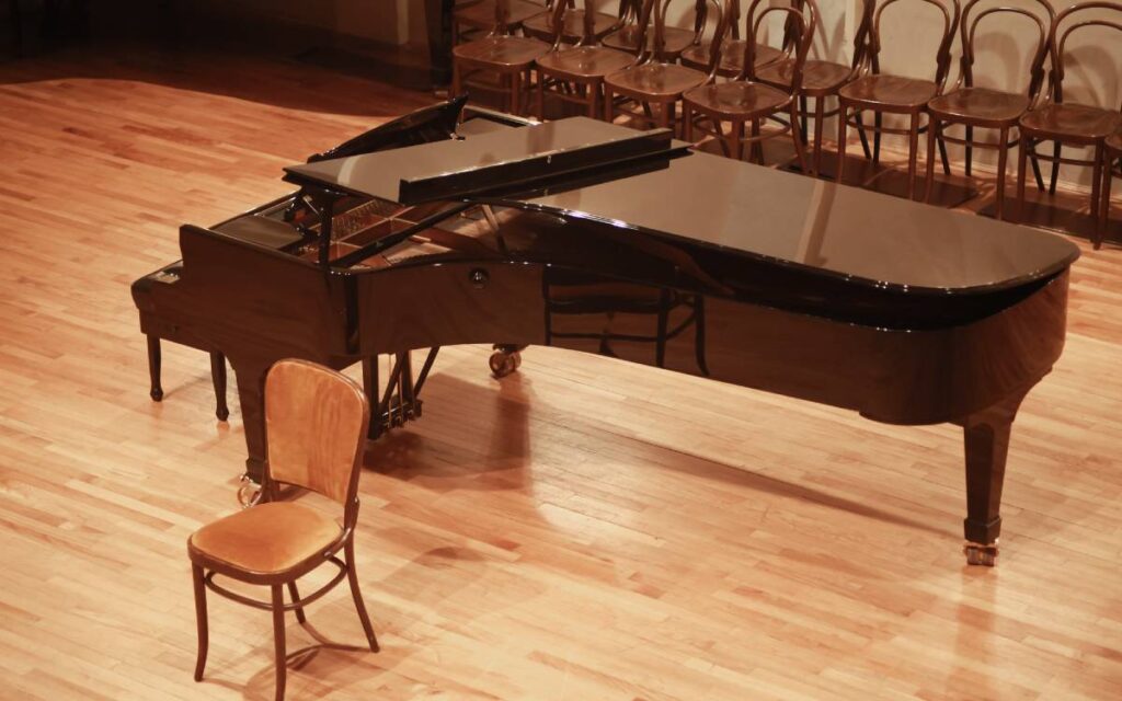 Open grand piano on stage