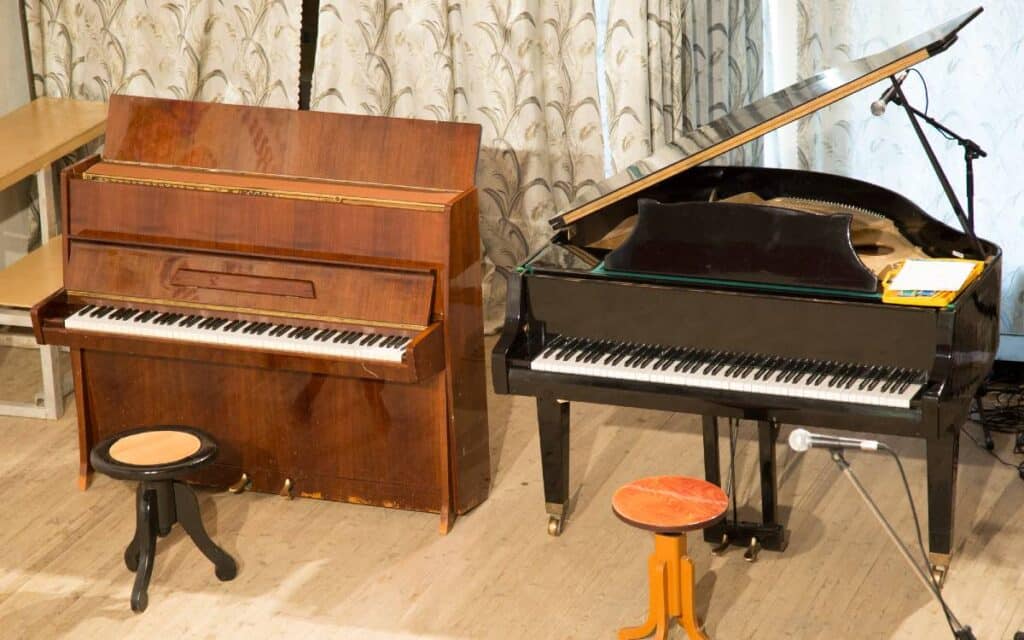 Upright piano and grand piano in a room