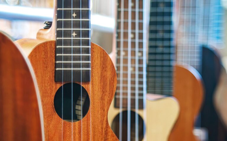 Best ukulele brands_different ukuleles hanging in a music store