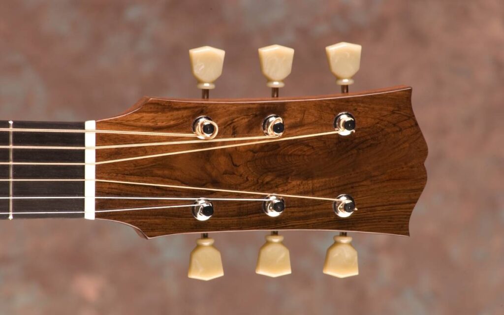 Brown acoustic guitar headstock