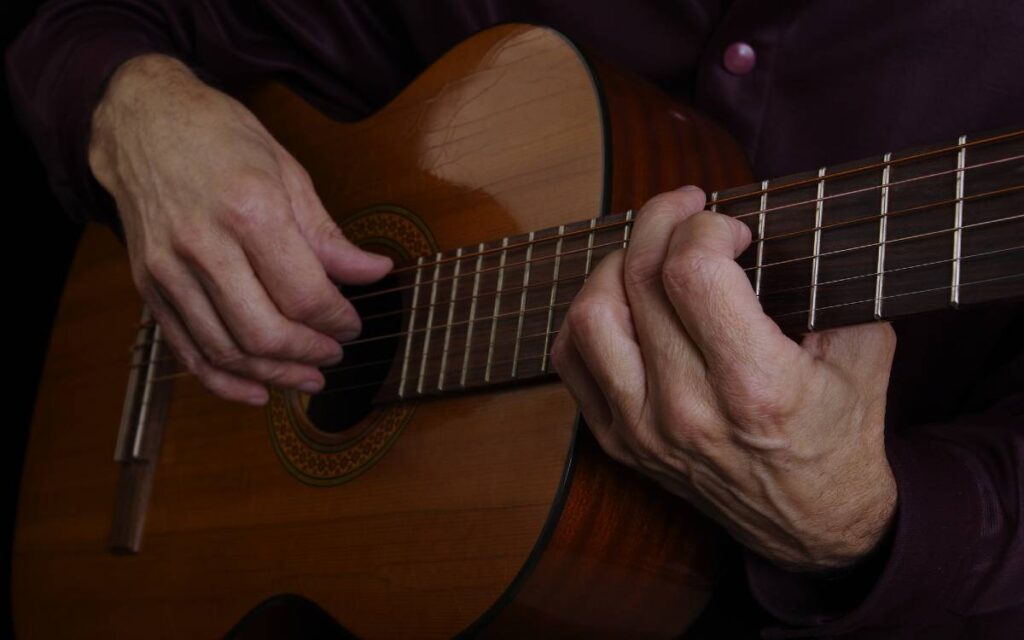 Close up of guitarist's hands and guitar