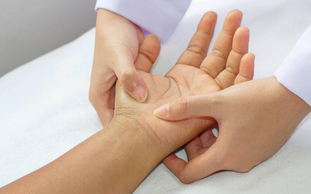 Female hands performing carpal tunnel massage