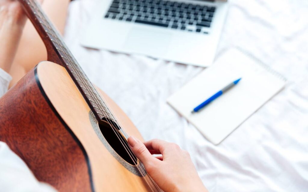 Female hands playing guitar