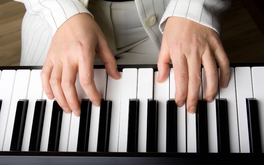 Hands on piano