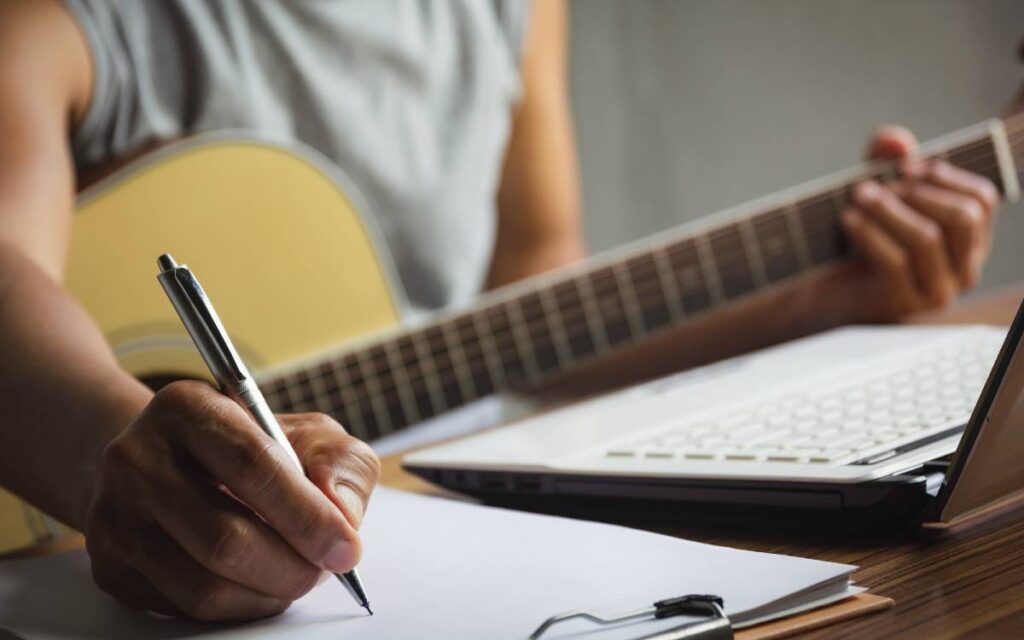 Man writing a song