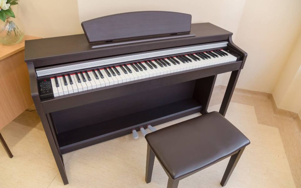 Modern digital piano and piano bench in a room