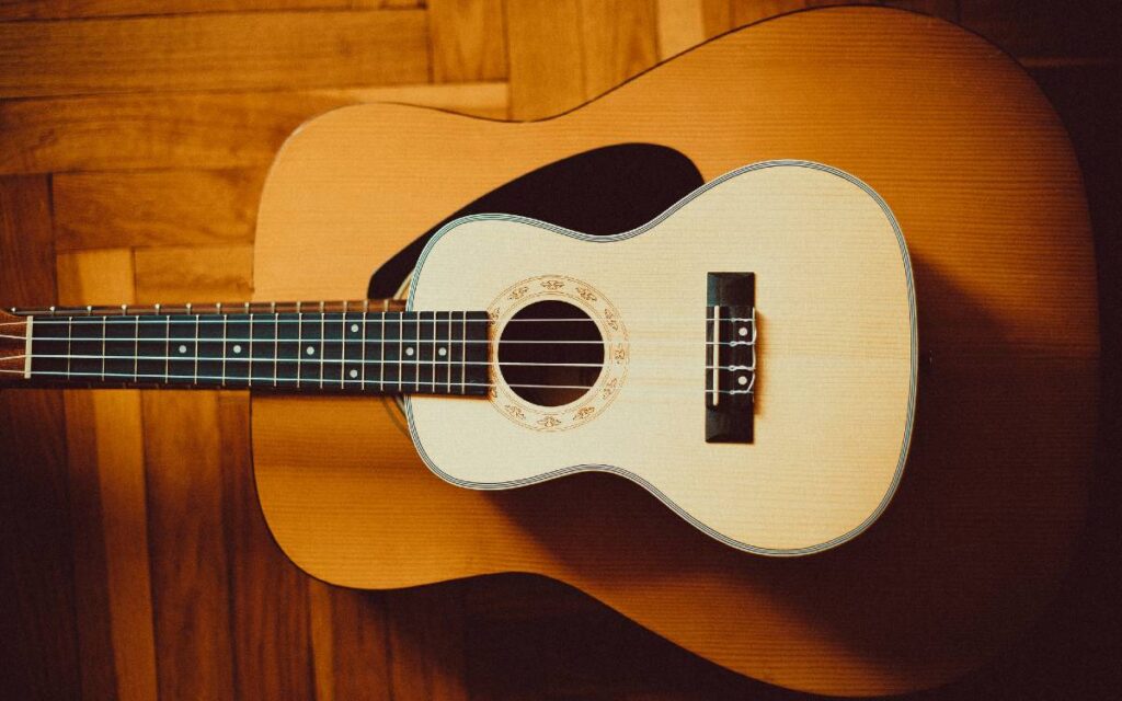 Ukulele lying on guitar