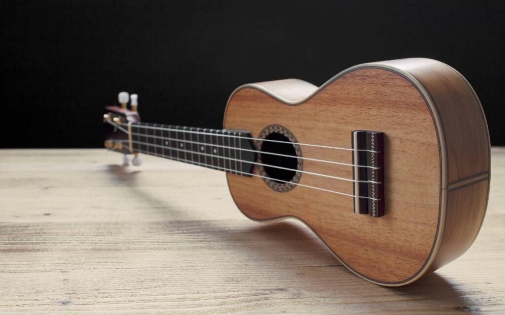 Ukulele on black background