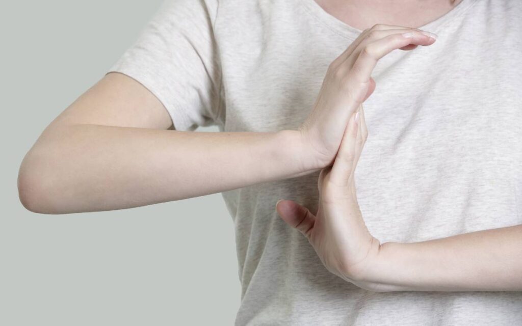 Woman stretching her wrist