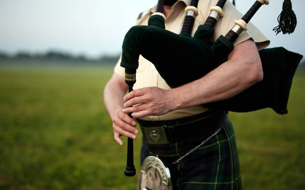 Close up of hands on bagpipe, one of the hardest instruments to learn