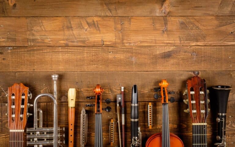 Hardest instrument to learn_different instruments on wooden background