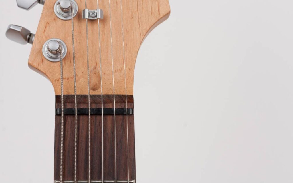 Close-up of nut on electric guitar