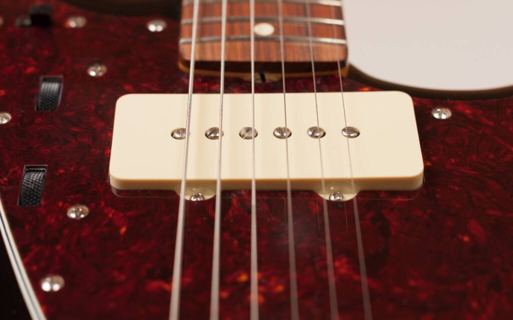 Close-up of pickup on electric guitar