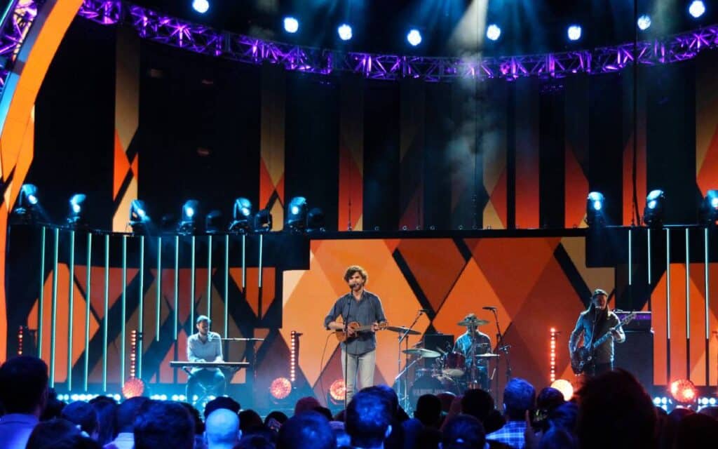 Vance joy playing the ukulele on stage